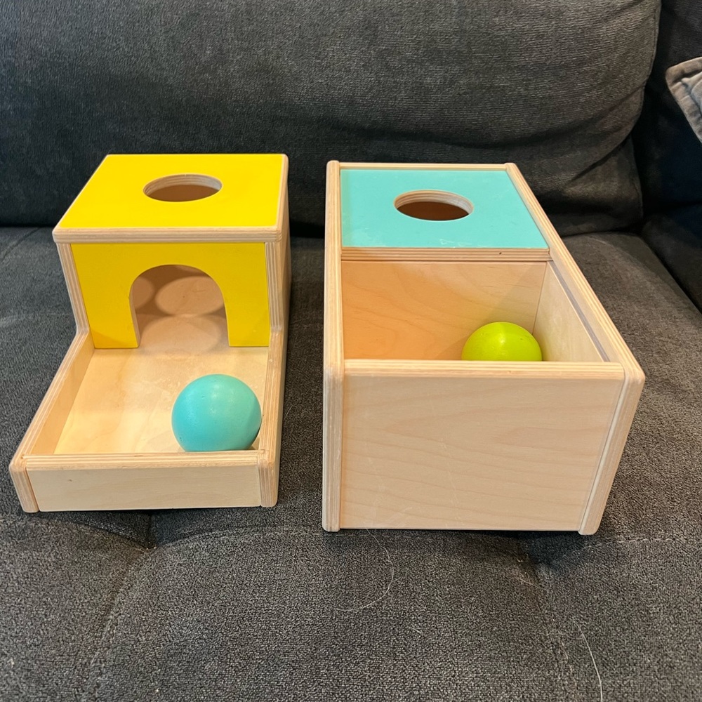 Lovevery object permanence boxes.